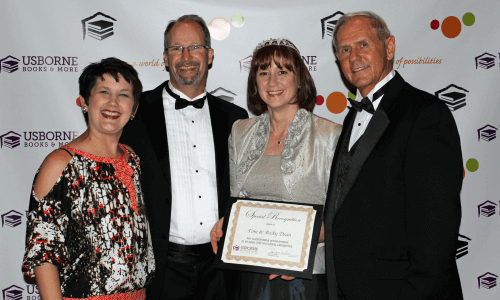 Photo of Heather Cobb (Usborne Books & More VP), Tom Dean, Becky Dean, Randall White (Usborne Books & More CEO/President)