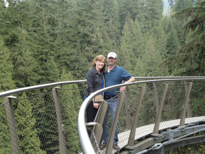Tom & Becky Dean on a glass aerial bridge